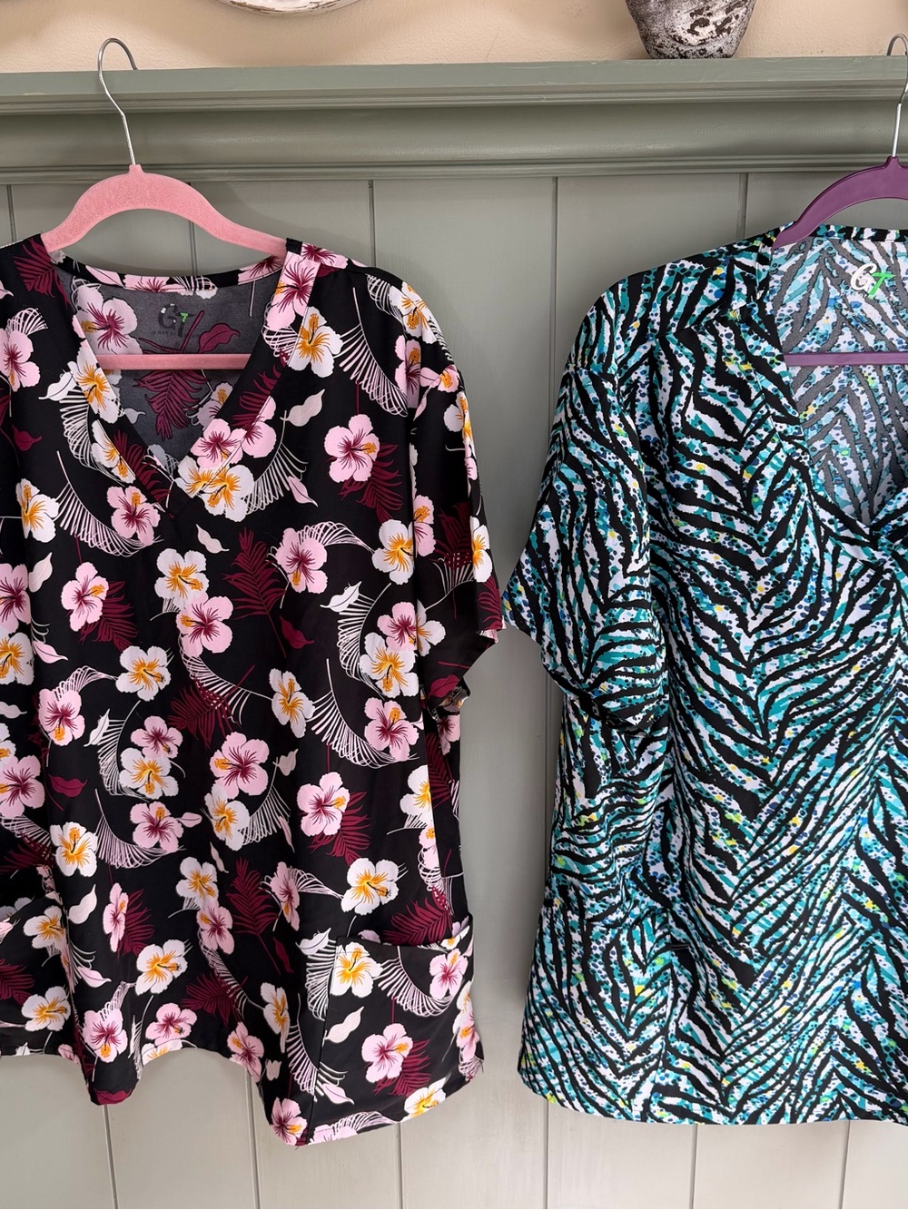 2 scrub tops. - Floral V-Neck Black Scrub Top with Pink & White Blooms